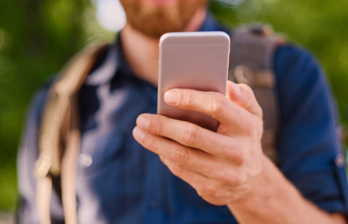 a man activating roaming on his mobile phone