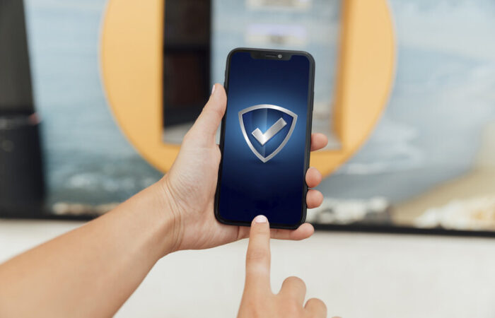 person unlocking a sim card